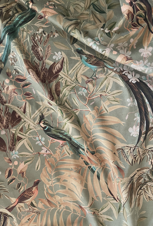Resplendent Woods velvet by Deus ex Gardenia in sage green, draped, showing peacocks and pheasants in trees