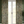 Resplendent Woods linen by Deus ex Gardenia in sage green, peacocks and pheasants in trees hung as curtains