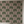 Palma wallpaper by Deus ex Gardenia in pink and green, tall palm trees behind a bed