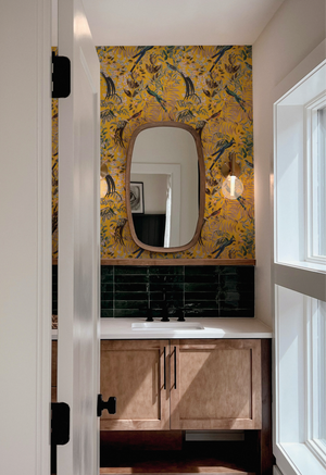 Resplendent Woods in India superwide wallpaper by Deus ex Gardenia in yellow on a bathroom wall