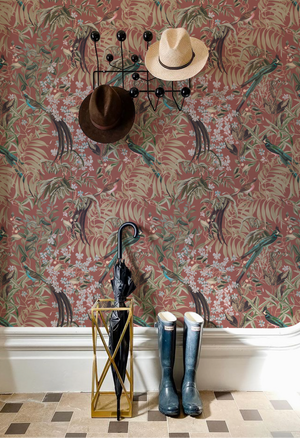 Resplendent Woods wallpaper by Deus ex Gardenia in teal, peacocks and pheasants in trees above a cabinet