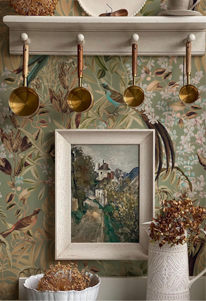 Resplendent Woods wallpaper by Deus ex Gardenia in sage green, peacocks and pheasants in trees in a kitchen