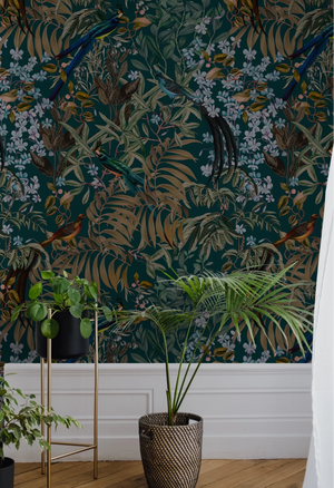 Resplendent Woods superwide wallpaper by Deus ex Gardenia in dark green, peacocks and pheasants in trees on a feature wall