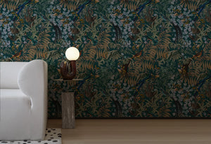 Resplendent Woods superwide wallpaper by Deus ex Gardenia in dark green, peacocks and pheasants in trees in a living room