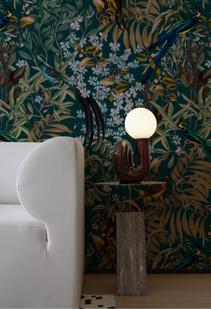 Resplendent Woods superwide wallpaper by Deus ex Gardenia in dark green in a styled room setting