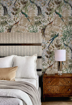 Resplendent Woods superwide wallpaper by Deus ex Gardenia in cream, peacocks and pheasants in trees in a bedroom