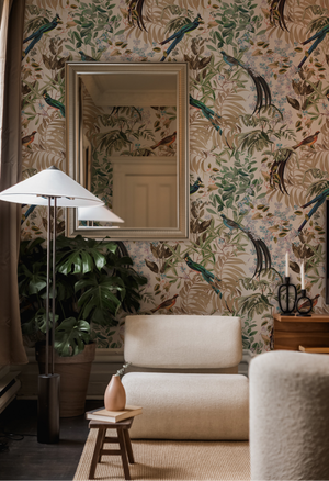 Resplendent Woods superwide wallpaper by Deus ex Gardenia in cream behind a sofa in a living room