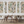 Resplendent Woods wallpaper by Deus ex Gardenia in cream and green, peacocks and pheasants in trees in a dining area