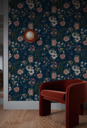 Beechcroft Garden wallpaper by Deus ex Gardenia in navy, garden flowers and foliage in a living room