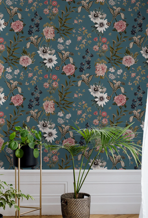 Beechcroft Garden wallpaper by Deus ex Gardenia in teal, garden flowers and foliage on a living room wall