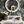 Beechcroft Garden wallpaper by Deus ex Gardenia in teal, garden flowers and foliage in a bathroom