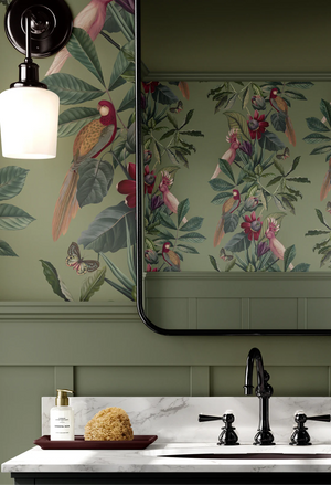 Passiflora wallpaper by Deus ex Gardenia in sage green, parrots and passion flowers on a bathroom wall