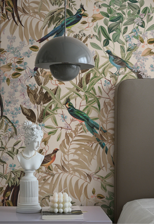 Resplendent Woods wallpaper by Deus ex Gardenia in cream and green, peacocks and pheasants in trees in a bedroom