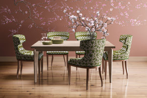Blossom wallpaper by Dami and Em Design in pink, blossom branches in a dining area