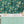 Disco Lemons wallpaper by Brand McKenzie in teal, lemon branches with disco balls above kitchen cabinets