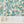 Disco Lemons wallpaper by Brand McKenzie in pink and green, lemon branches with disco balls above kitchen cabinets