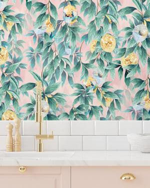 Disco Lemons wallpaper by Brand McKenzie in pink and green, lemon branches with disco balls above kitchen cabinets