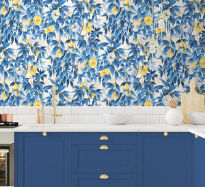 Disco Lemons wallpaper by Brand McKenzie in blue, lemon branches with disco balls above kitchen cabinets
