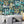 Downtown Deco wallpaper by Brand McKenzie in indigo blue, close-up of Art Deco skyscrapers