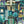 Downtown Deco wallpaper by Brand McKenzie in teal, detail of Art Deco skyscrapers