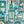 Downtown Deco wallpaper by Brand McKenzie in mint green, pattern detail of Art Deco skyscrapers