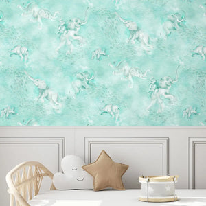 Elephant Breaststroke wallpaper by Brand McKenzie in aqua behind a daybed in a child's room
