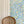 Enchanted Leaves wallpaper by Claire de Quénetain in pink and blue, a hand-painted floral design in a styled room setting
