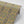 Esprit wallpaper by Tatie Lou in mustard, partly unrolled roll showing an ornate medallion print
