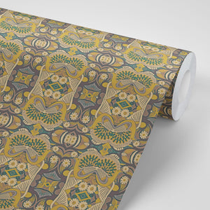 Esprit wallpaper by Tatie Lou in mustard, partly unrolled roll showing an ornate medallion print