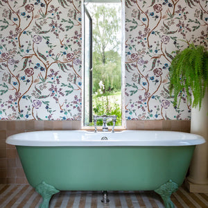 Eversley wallpaper by Parker and Jules in cream and teal, trailing roses in a bathroom