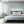 Exotic Birds wallpaper by Brand McKenzie in pale blue, hummingbirds in flight in a bedroom