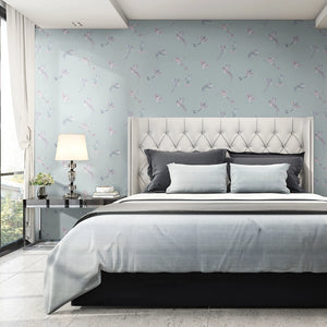 Exotic Birds wallpaper by Brand McKenzie in pale blue, hummingbirds in flight in a bedroom