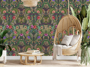 Exotica wallpaper by Victoria Sanders in black, jungle animals and tropical flowers behind a sofa in a living room