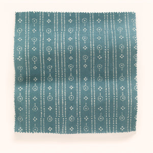 Birdlip linen by Parker and Jules in blue, in soft folds showing a small block-print stripe
