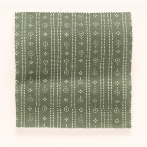 Birdlip linen by Parker and Jules in dark green, draped, showing a small block-print stripe