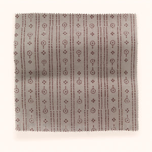 Birdlip linen by Parker and Jules in dusky pink, draped, showing a small block-print stripe