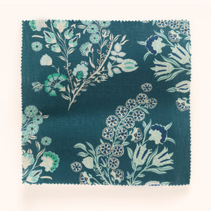 Coromandel Flower linen by Parker and Jules in blue, draped close-up of paisley flower sprays