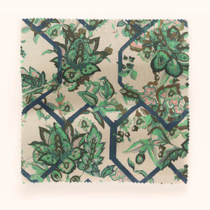 Creeping Trellis linen by Parker and Jules in green and pink, in soft folds showing flowers on a trellis