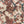 Creeping Trellis linen by Parker and Jules in red, draped, showing flowers on a trellis