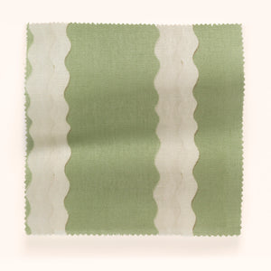 Double Scroll Stripe linen by Parker and Jules in green, in soft folds showing wavy scroll stripes