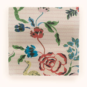 Eversley linen by Parker and Jules in green and pink, draped, showing trailing roses
