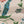 Eversley linen by Parker and Jules in green and pink, in soft folds showing trailing roses
