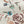 Eversley linen by Parker and Jules in cream and teal, flat sample of trailing roses