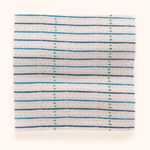 Eversley Stripe linen by Parker and Jules in green and pink, draped, showing a fine woven stripe