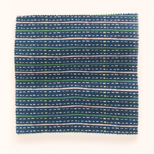 Eversley Stripe linen by Parker and Jules in navy, in soft folds showing a fine woven stripe
