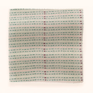 Eversley Stripe linen by Parker and Jules in cream and teal, draped close-up of a fine woven stripe