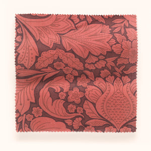 Folk Floral linen by Parker and Jules in red, in soft folds showing bold folk flowers
