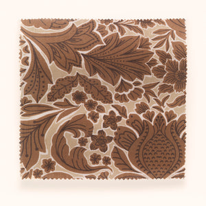 Folk Floral linen by Parker and Jules in beige, in soft folds showing bold folk flowers