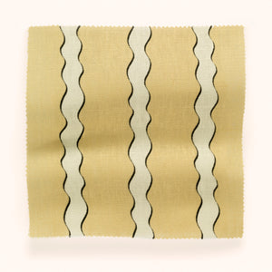 Scroll Stripe linen by Parker and Jules in cream, draped, showing wavy scroll stripes