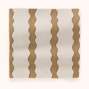 Scroll Stripe linen by Parker and Jules in yellow, draped, showing wavy scroll stripes